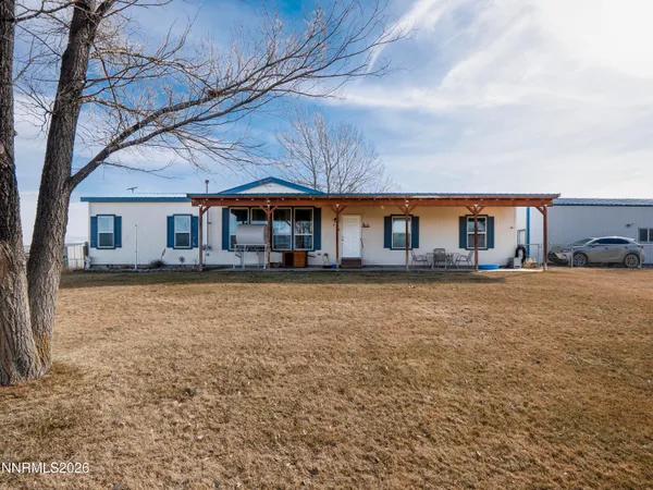 a front view of house with yard and seating area