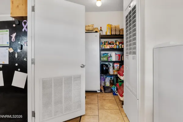 a view of a hallway with shelves