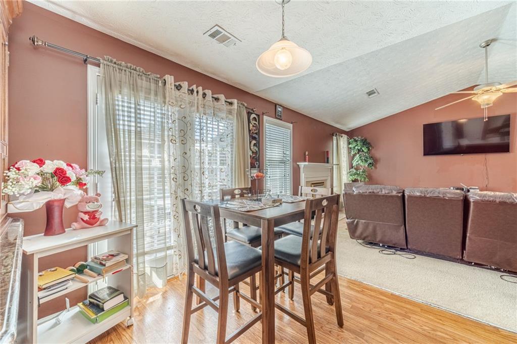 1185 Wendy Way Winder, GA 30680 - Photo 17 of 43 a view of a dining room with furniture window and wooden floor