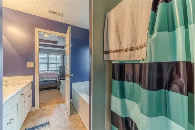 a bathroom with a sink and a large mirror