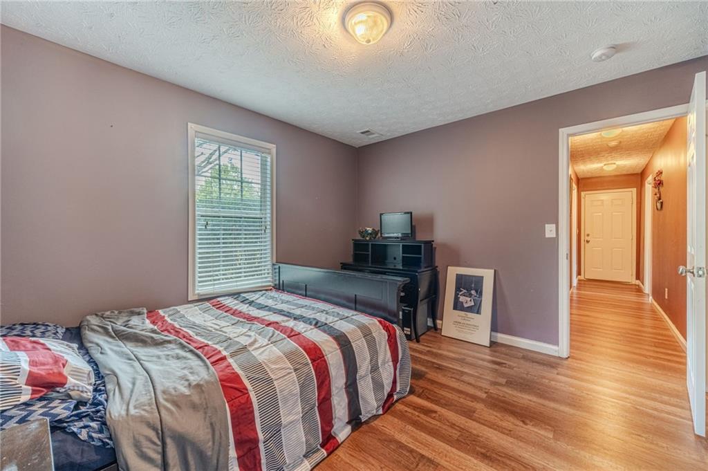 1185 Wendy Way Winder, GA 30680 - Photo 30 of 43 a bedroom with a bed and a window