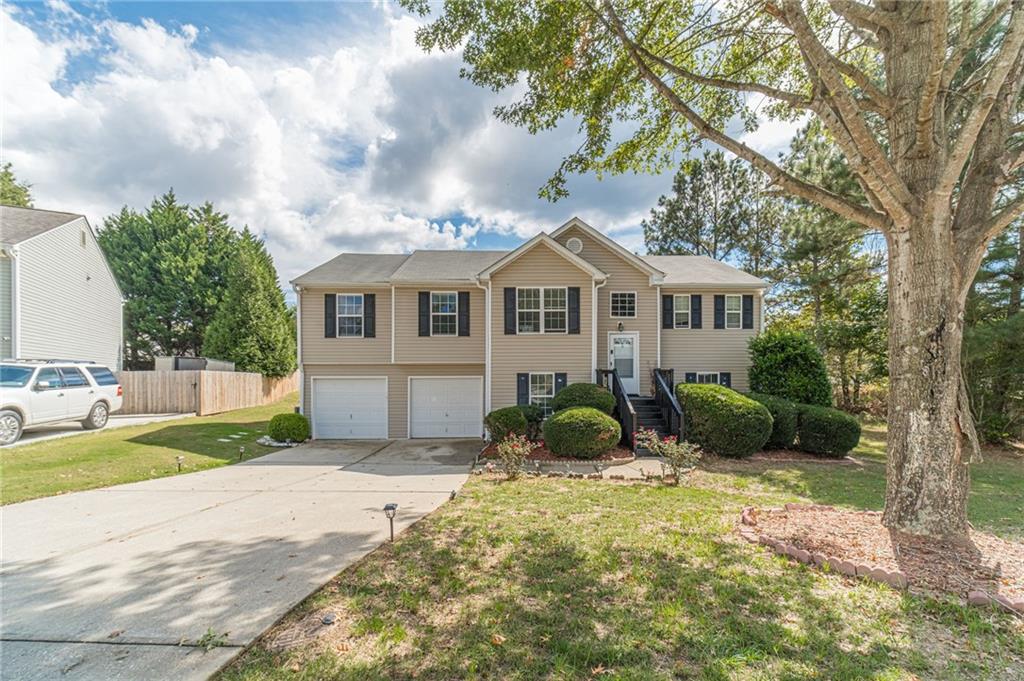 1185 Wendy Way Winder, GA 30680 - Photo 3 of 43 a view of a house with a yard and potted plants