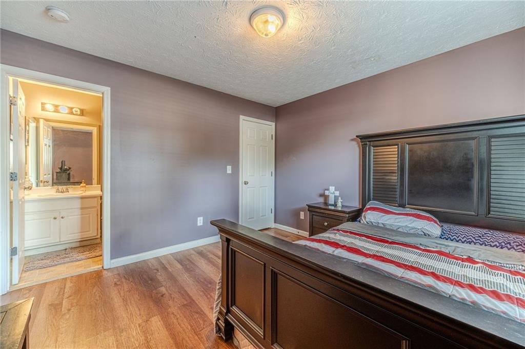 1185 Wendy Way Winder, GA 30680 - Photo 31 of 43 a bedroom with bed and view of bathroom
