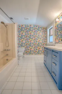 a bathroom with a bathtub and a shower