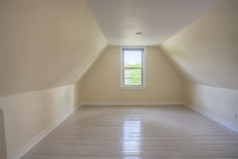 an empty room with a empty space and windows