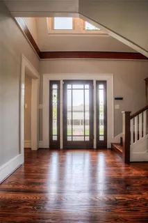 a view of an entryway with wooden floor
