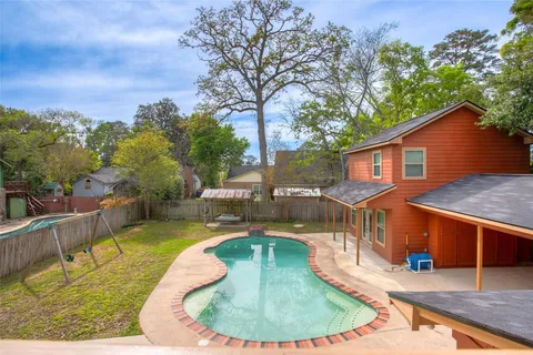 swimming pool view with a seating space