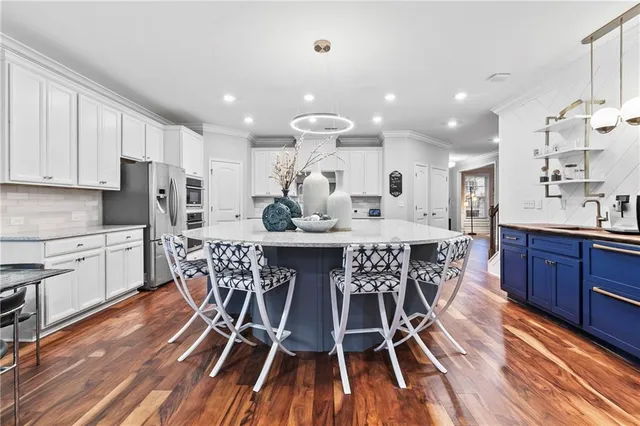a kitchen with wooden cabinets and center island