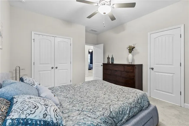 a spacious bathroom with a double vanity sink and a mirror
