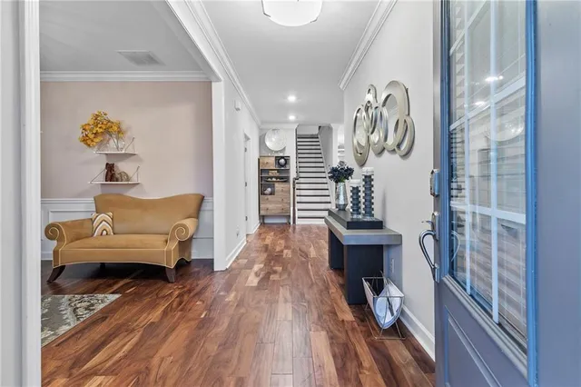 a living room with furniture a rug and a window