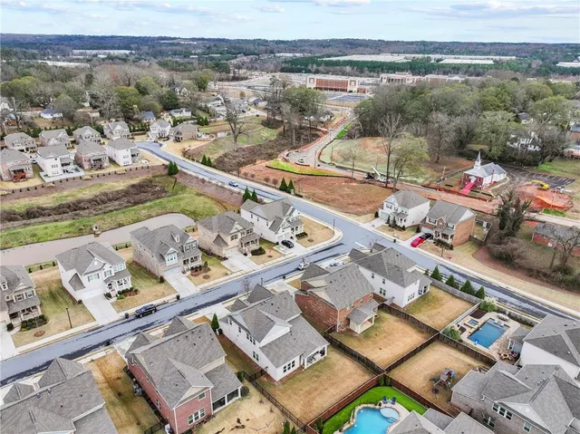 an aerial view of residential houses with outdoor space