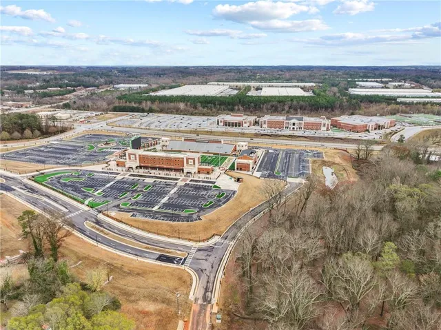 an aerial view of a house with yard swimming pool and outdoor seating