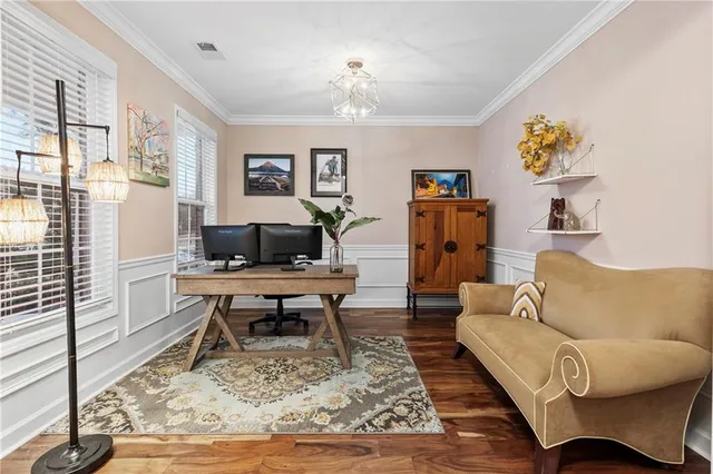 a living room with fireplace furniture and a flat screen tv