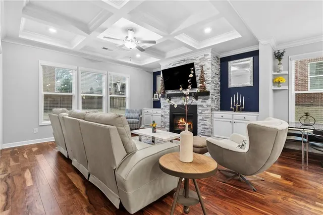 a living room with furniture or couch and a large window