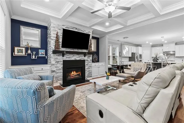 a living room with fireplace and a flat screen tv