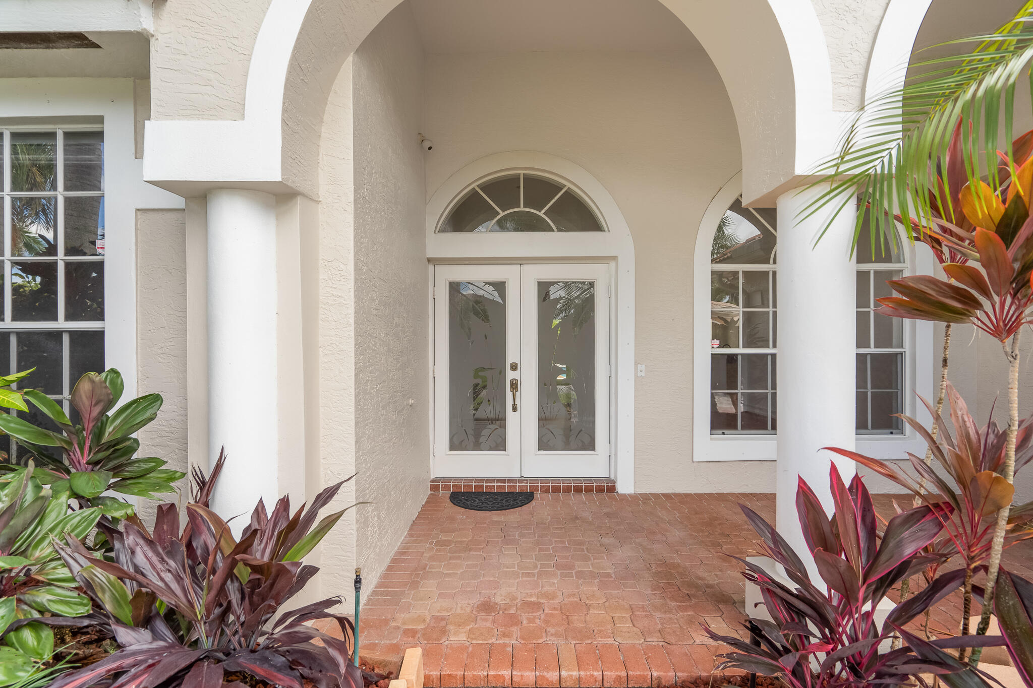 12253 Rockledge Circle Boca Raton, FL 33428 - Photo 12 of 36 a view of a front door and small garden