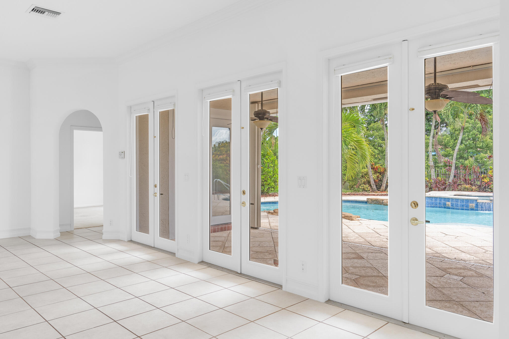 12253 Rockledge Circle Boca Raton, FL 33428 - Photo 13 of 36 an empty room with windows