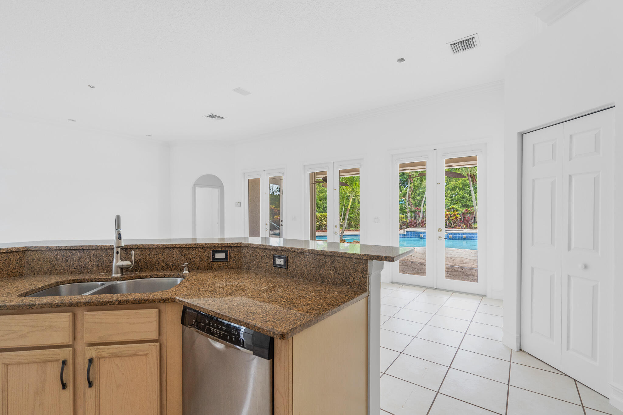 12253 Rockledge Circle Boca Raton, FL 33428 - Photo 16 of 36 a bathroom with a granite countertop sink and a large mirror