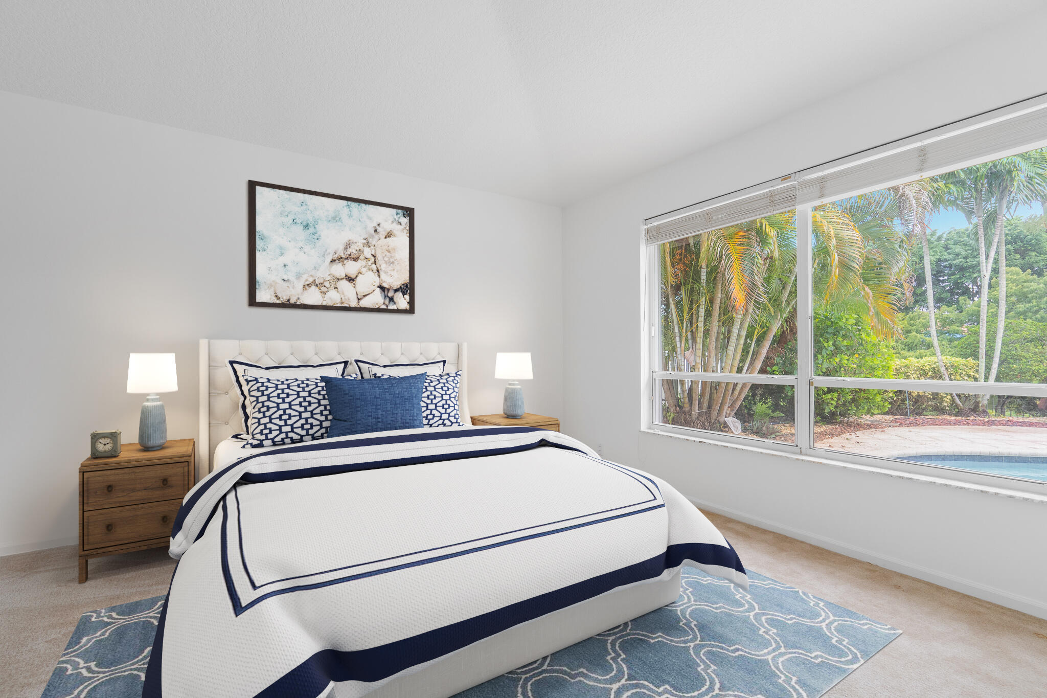 12253 Rockledge Circle Boca Raton, FL 33428 - Photo 18 of 36 a bedroom with a bed and a large window