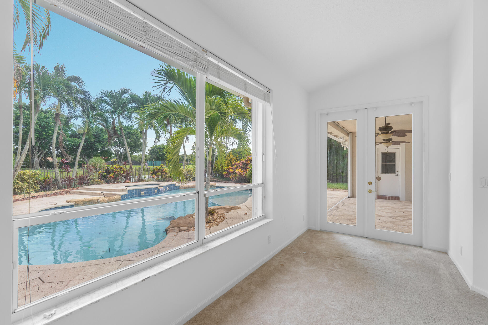 12253 Rockledge Circle Boca Raton, FL 33428 - Photo 20 of 36 a view of a room with a large window and front door
