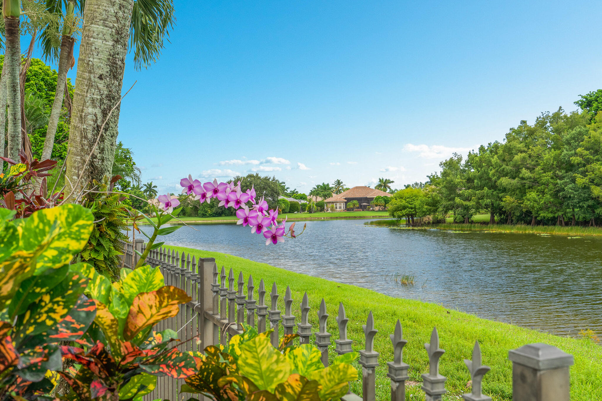 12253 Rockledge Circle Boca Raton, FL 33428 - Photo 2 of 36 a view of a lake with a big yard