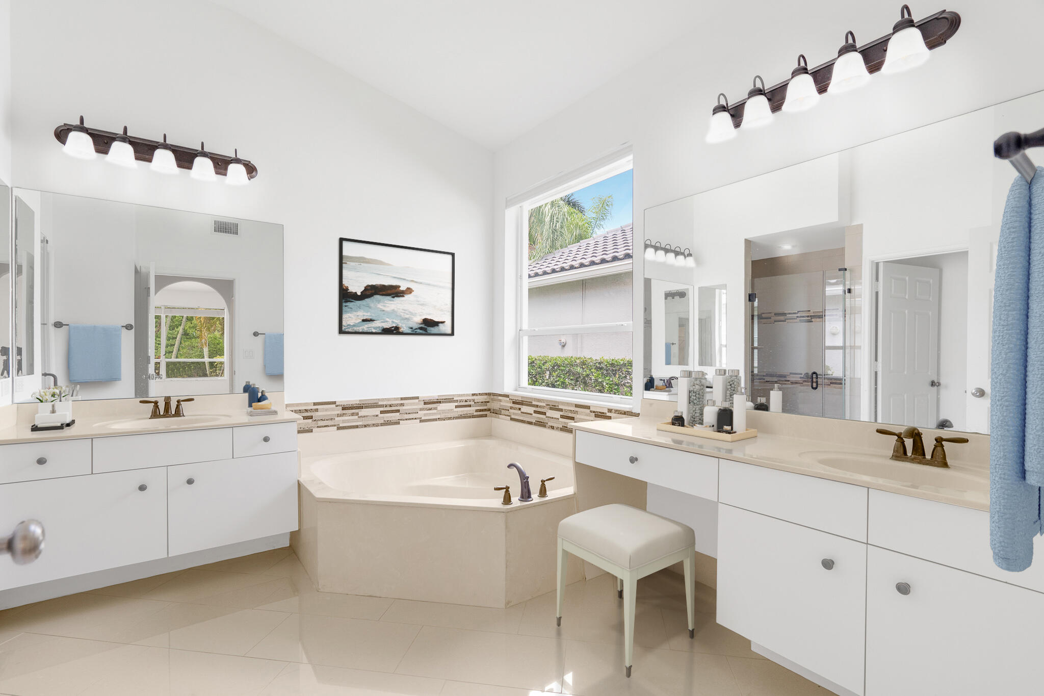 12253 Rockledge Circle Boca Raton, FL 33428 - Photo 21 of 36 a bathroom with a tub a sink double vanity and a mirror