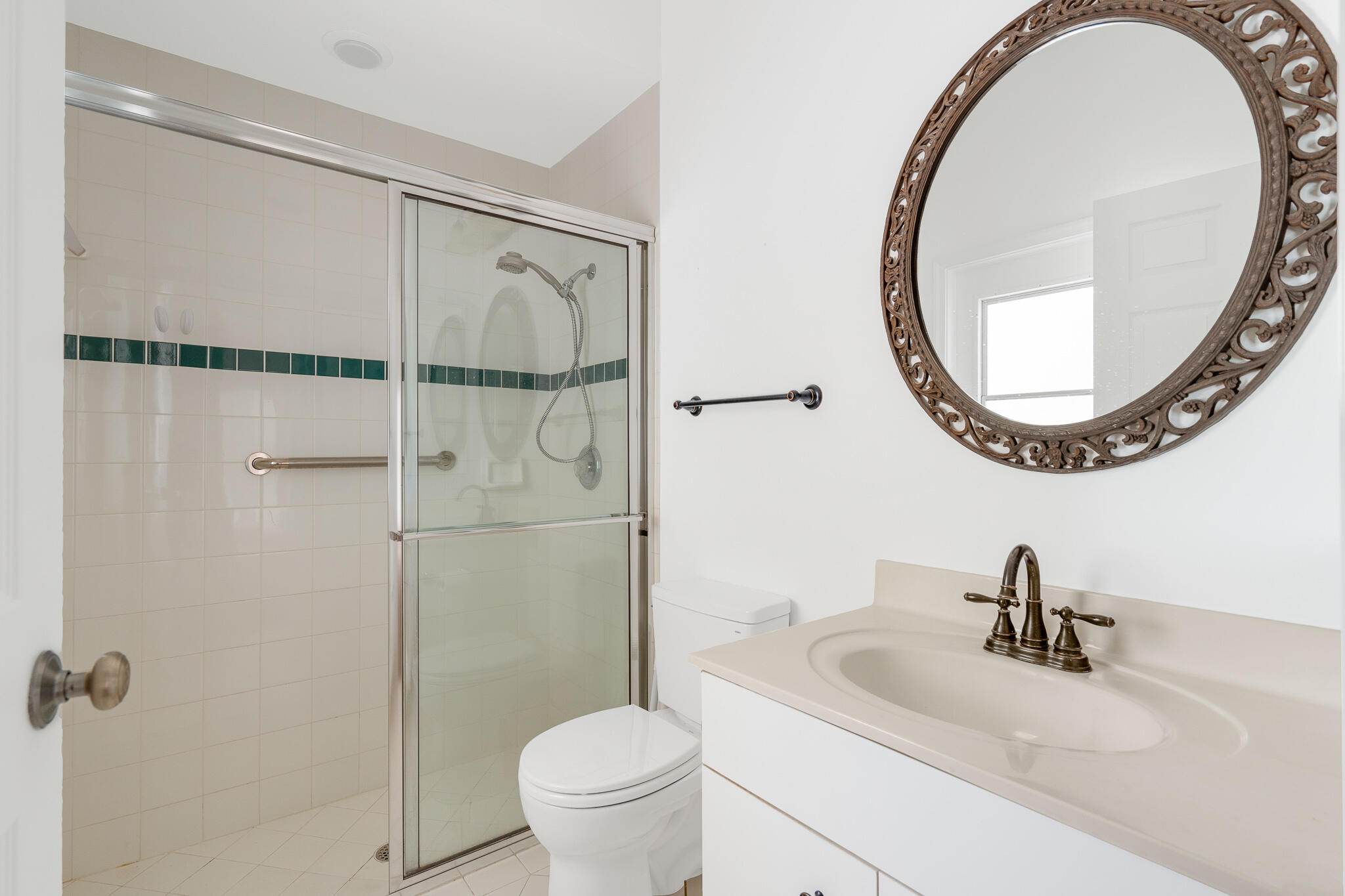 12253 Rockledge Circle Boca Raton, FL 33428 - Photo 24 of 36 a bathroom with a sink and a mirror