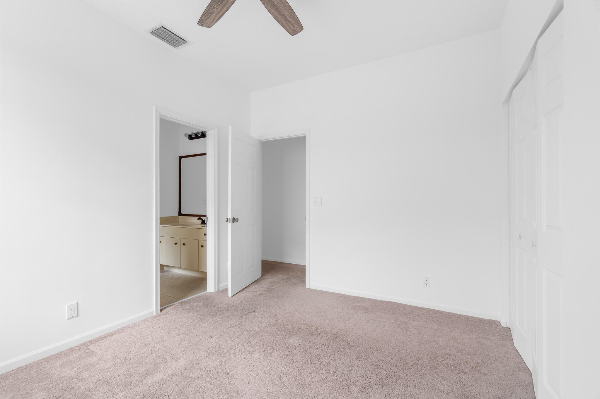 12253 Rockledge Circle Boca Raton, FL 33428 - Photo 25 of 36 an empty room with closet and windows