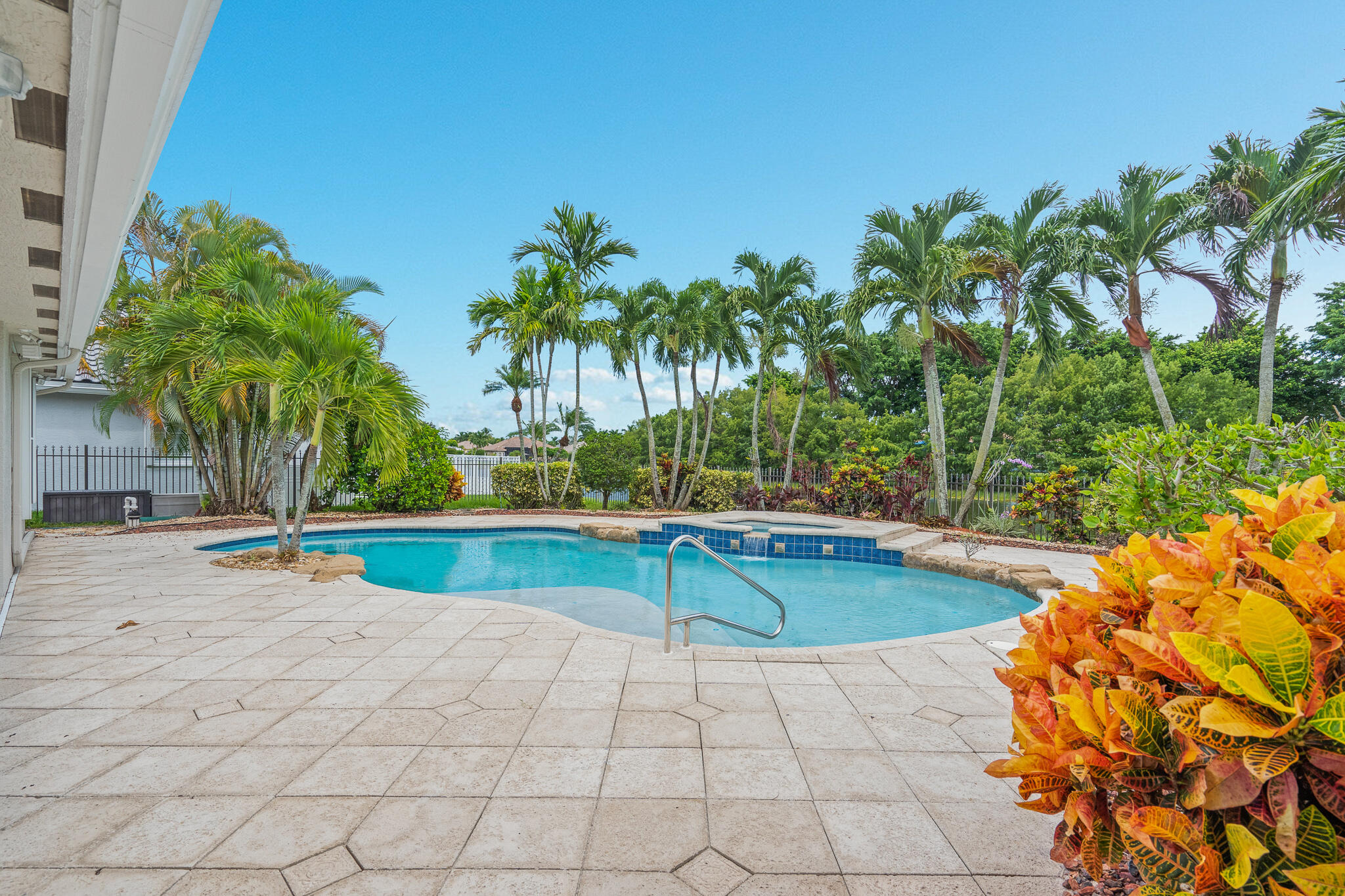 12253 Rockledge Circle Boca Raton, FL 33428 - Photo 28 of 36 a view of swimming pool with a table and chair