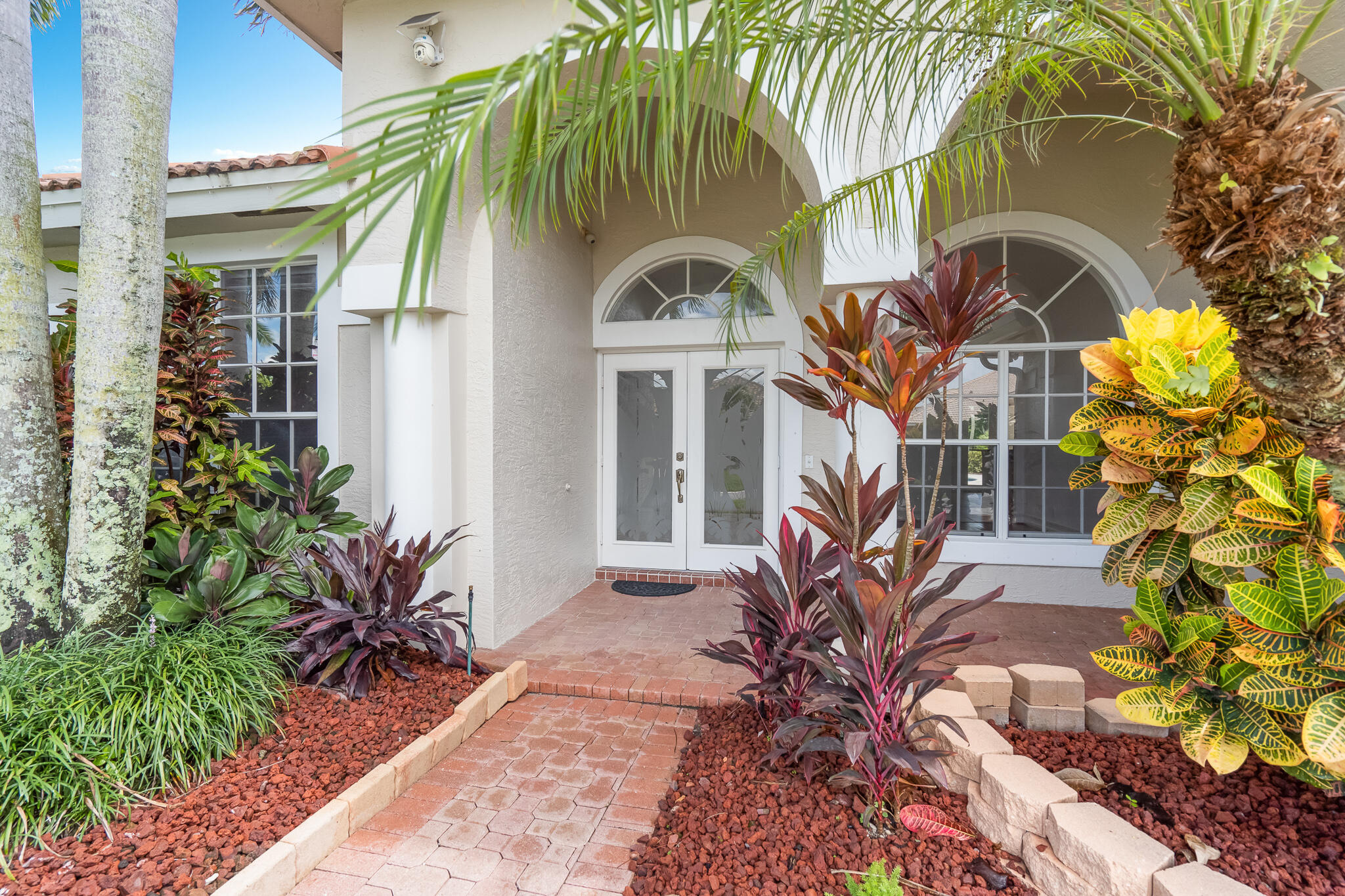 12253 Rockledge Circle Boca Raton, FL 33428 - Photo 4 of 36 a view of a house with a flower garden
