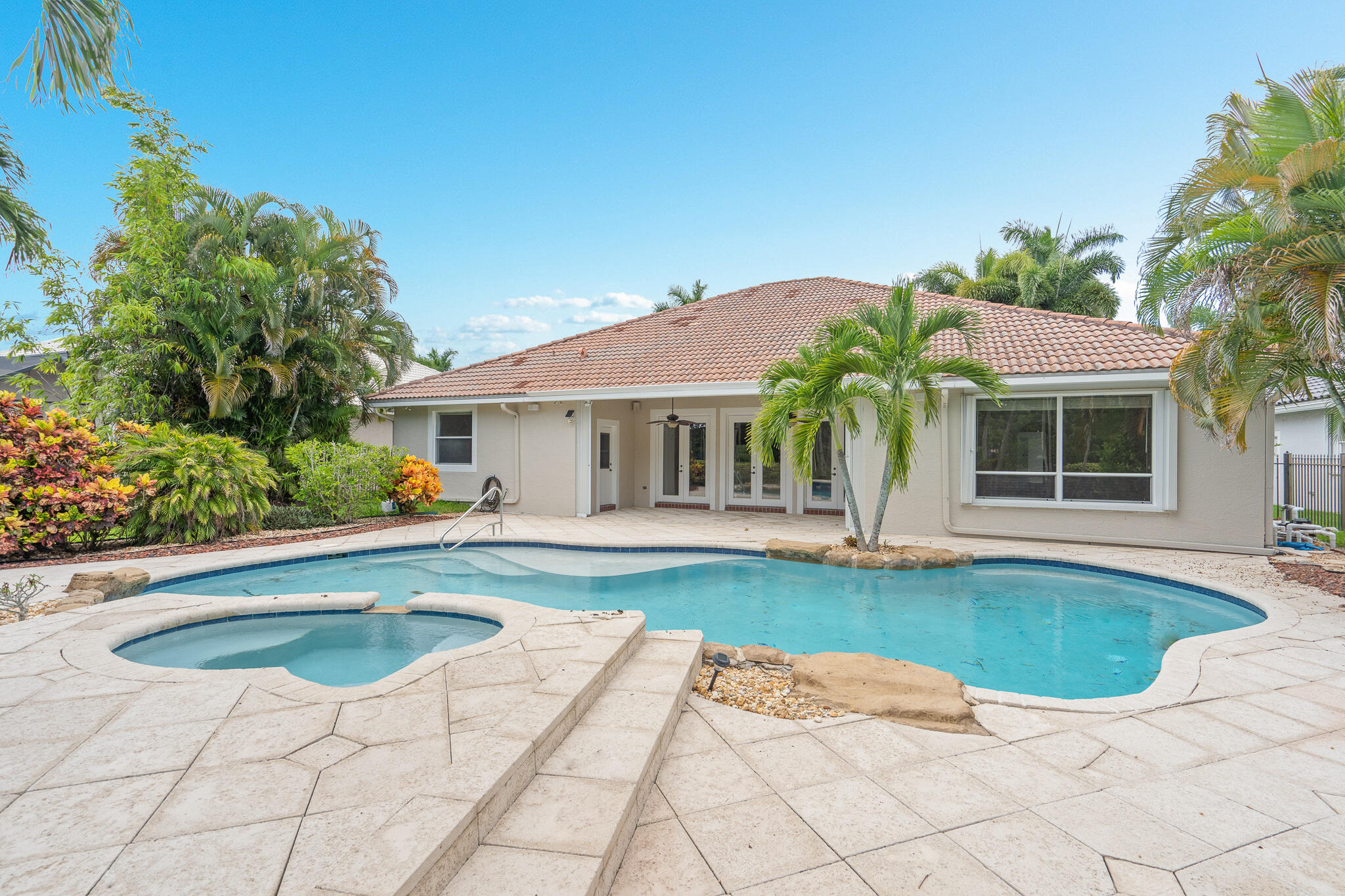 12253 Rockledge Circle Boca Raton, FL 33428 - Photo 7 of 36 a view of house with swimming pool outdoor seating