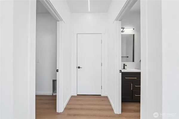 a view of bathroom with a sink and mirror