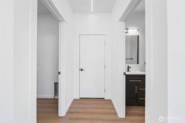 a view of bathroom with a sink and mirror