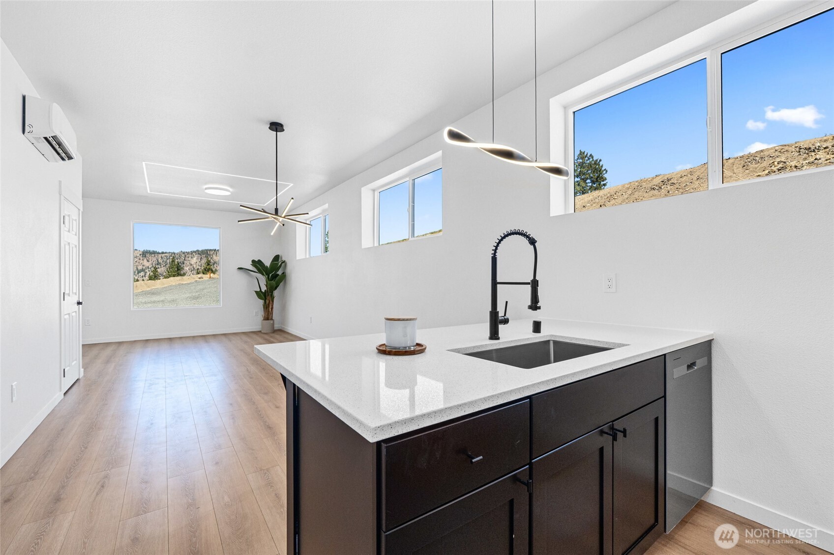 38265 Timber Lane North Lincoln, WA 99147 - Photo 13 of 37 a kitchen with a sink cabinets and wooden floor