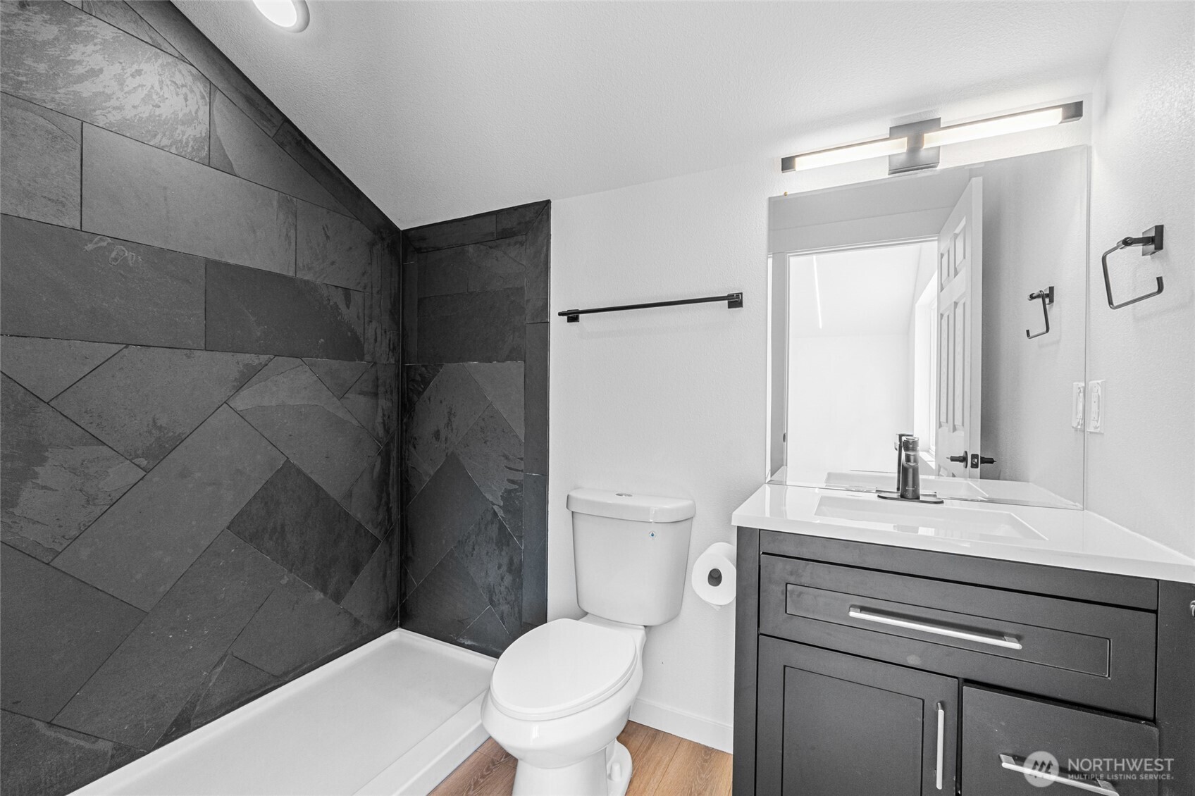 38265 Timber Lane North Lincoln, WA 99147 - Photo 17 of 37 a bathroom with a sink a toilet a mirror and shower