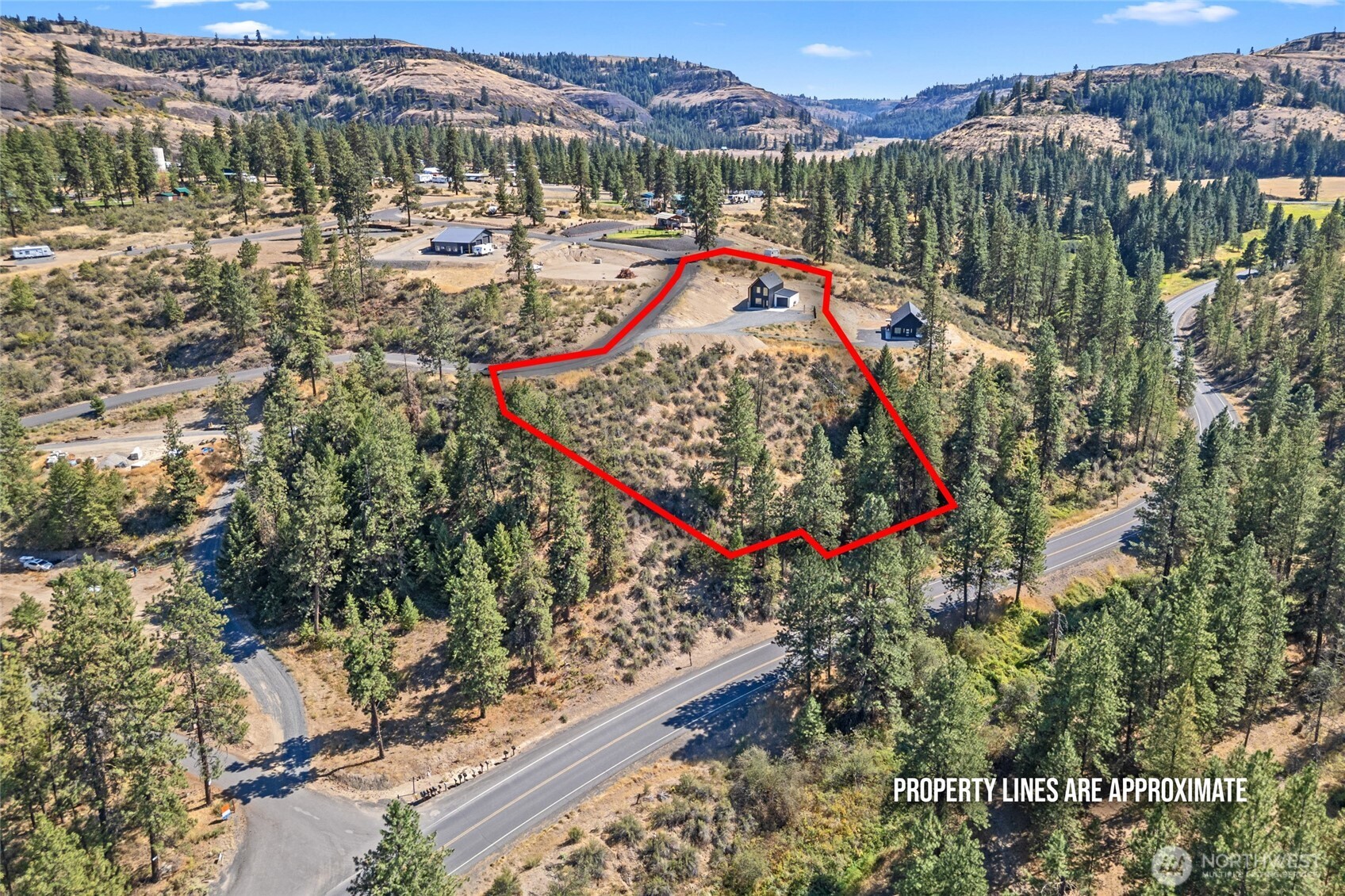 38265 Timber Lane North Lincoln, WA 99147 - Photo 32 of 37 a view of a lake with a mountain in the background
