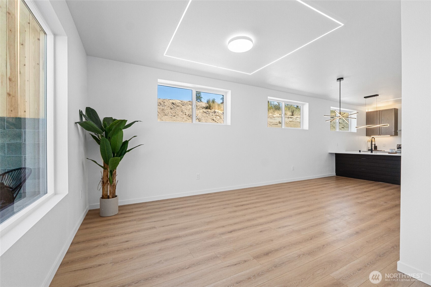 38265 Timber Lane North Lincoln, WA 99147 - Photo 6 of 37 a view of a room with wooden floor and potted plant