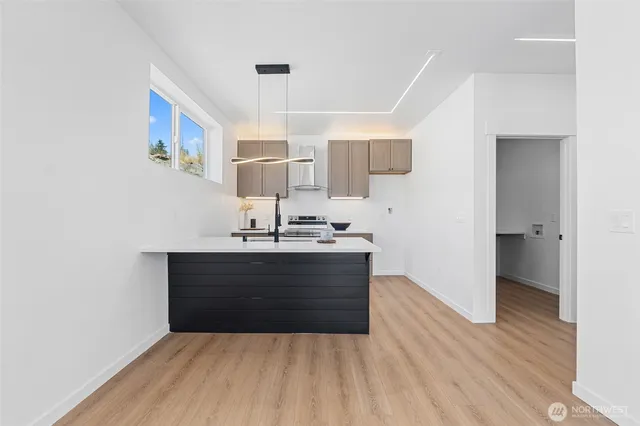 a view of kitchen and wooden floor