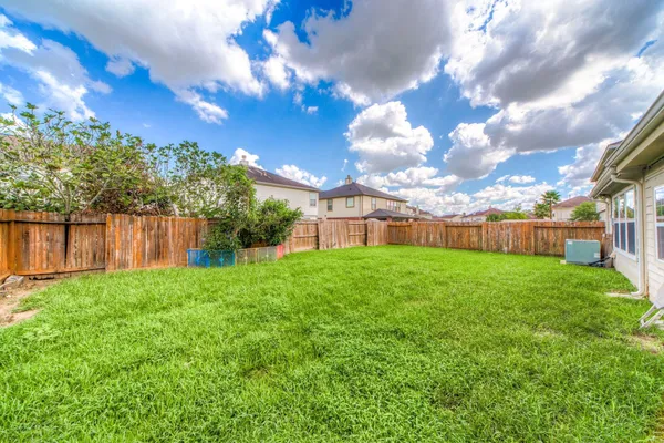 a view of a house with a big yard