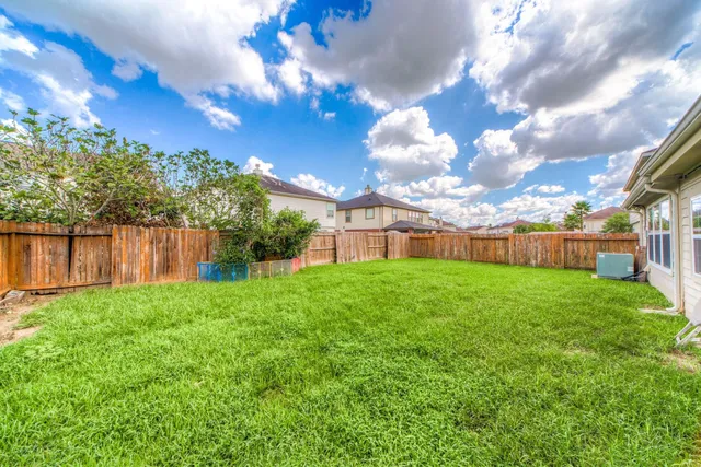 a view of a house with a big yard
