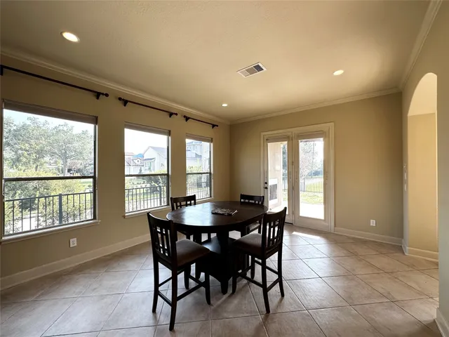 a view of a chandelier in big room and chandelier