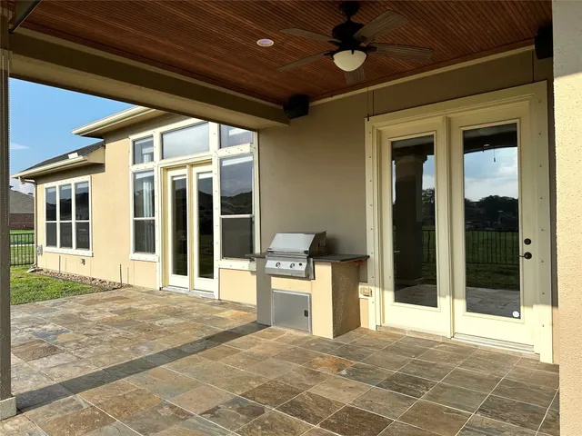 a front view of a house with plants