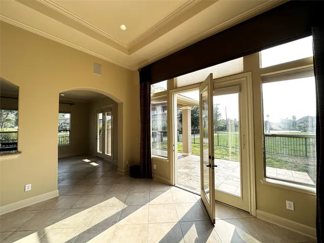 a view of livingroom with furniture and large windows