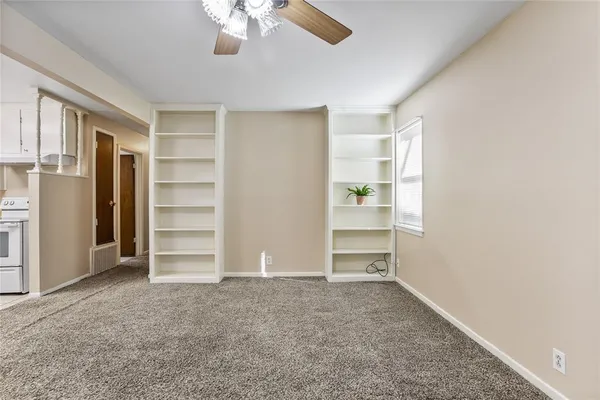 a view of room with walk in closet and window