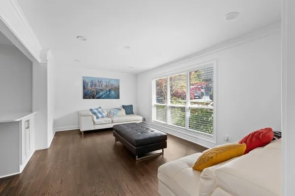 a bedroom with two beds and a large window
