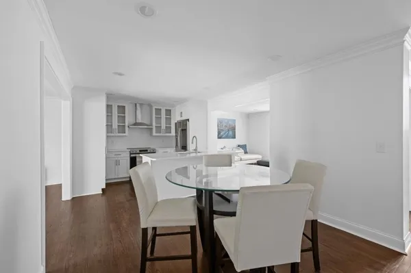 a view of a dining room with furniture and wooden floor