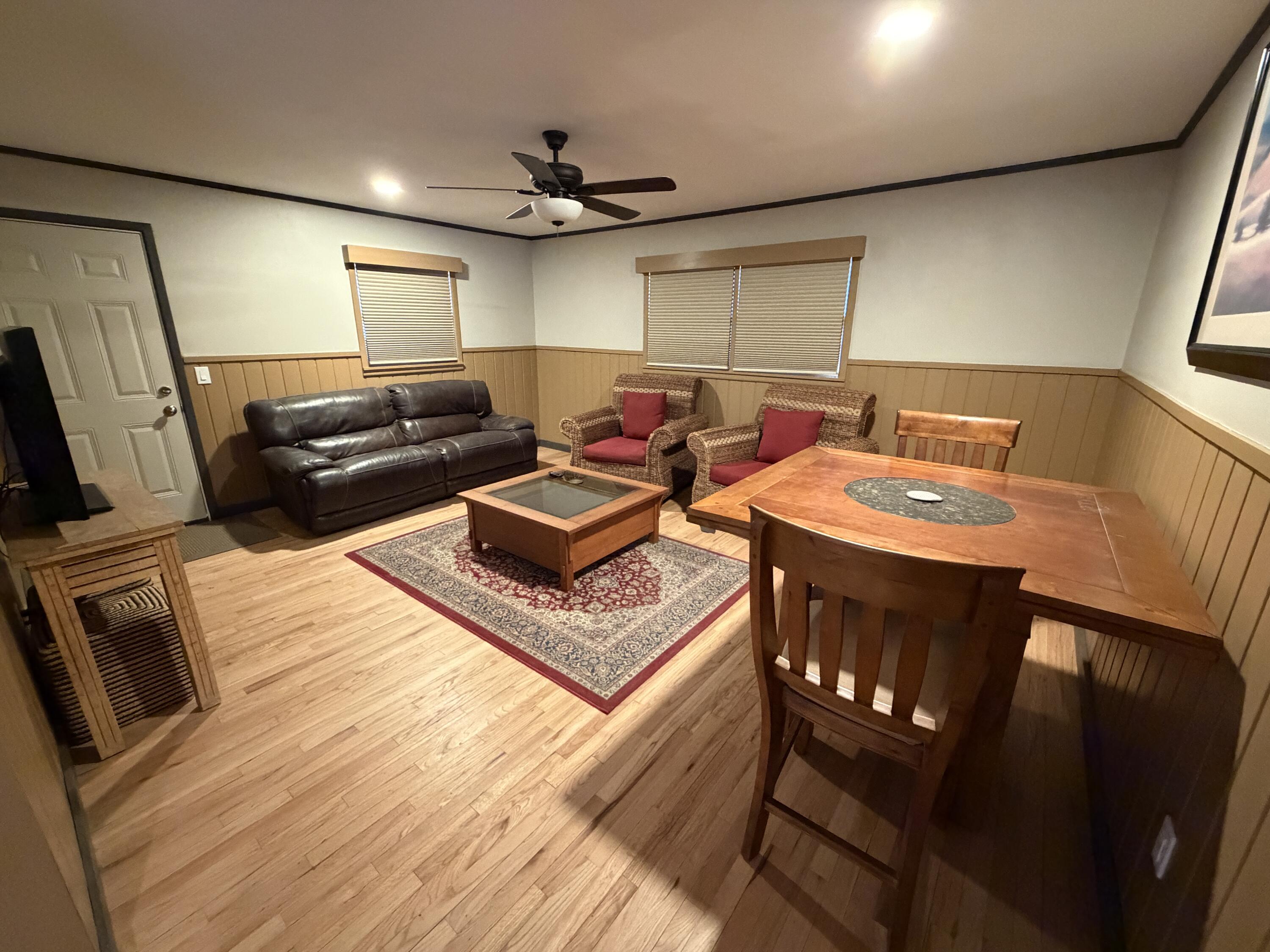 3113 38th Street Lubbock, TX 79413 - Photo 12 of 22 a living room with furniture and a flat screen tv