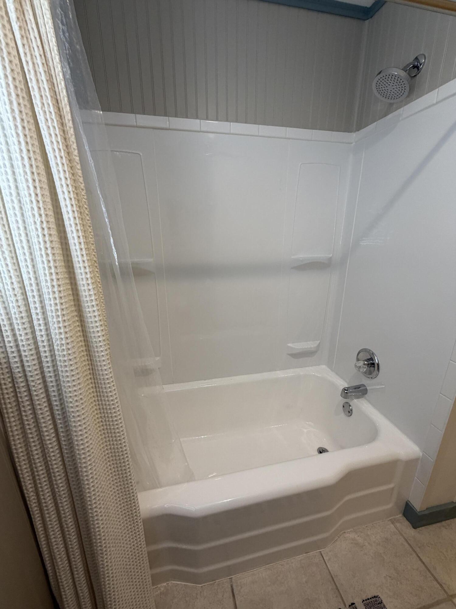 3113 38th Street Lubbock, TX 79413 - Photo 15 of 22 a bathroom with bathtub and shower