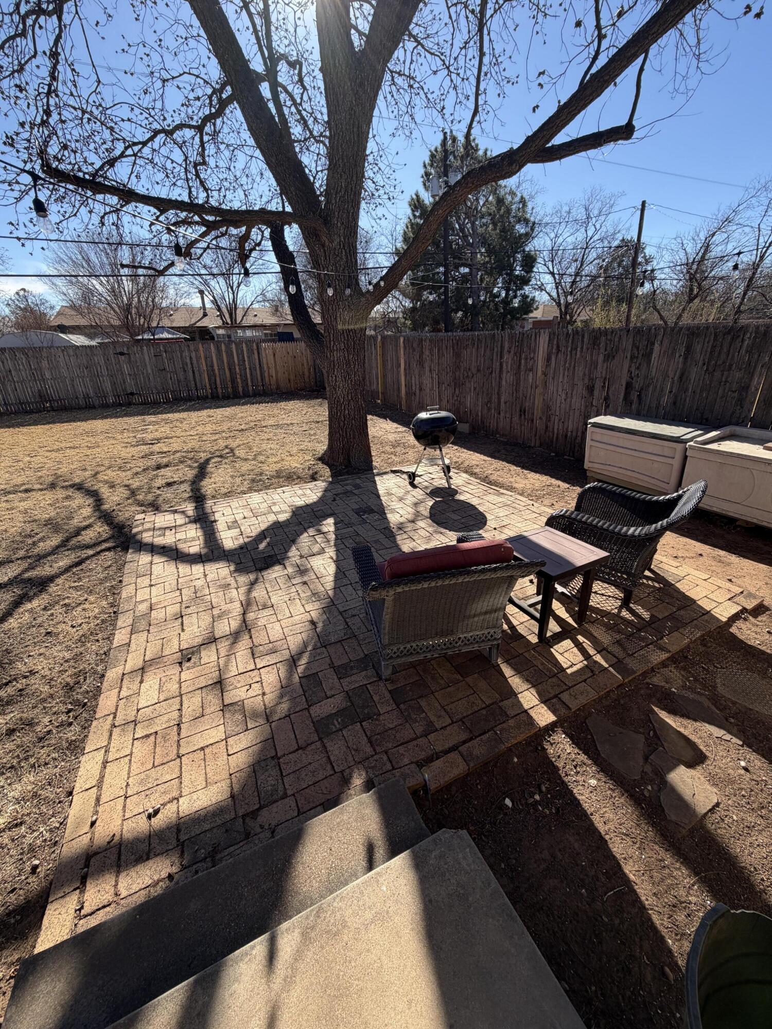3113 38th Street Lubbock, TX 79413 - Photo 22 of 22 a view of backyard with wooden floor and outdoor seating