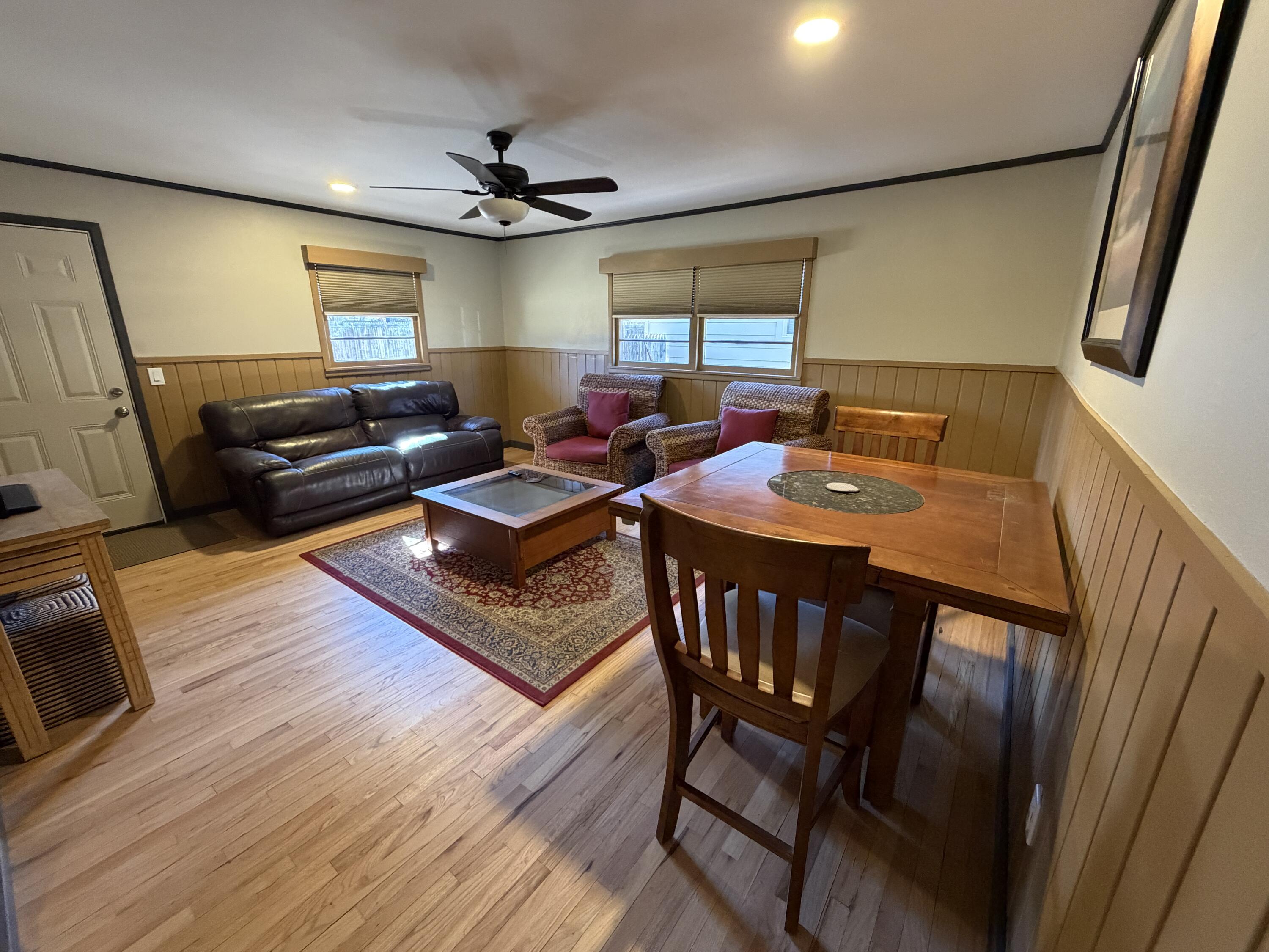 3113 38th Street Lubbock, TX 79413 - Photo 9 of 22 a living room with furniture and a wooden floor